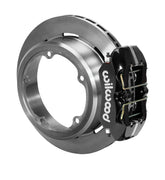 Wilwood black low-profile rear caliper beside an assembled plain-face rotor with a deep parking-brake hat