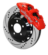 Wilwood red AERO6 caliper over an assembled 14.25-inch drilled-and-slotted rotor and separate mounting hat