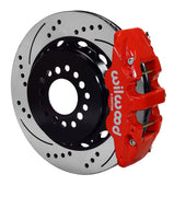 Wilwood red AERO4 caliper over an assembled 14.25-inch drilled-and-slotted rotor and separate mounting hat