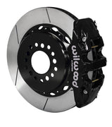 Wilwood black AERO4 caliper over an assembled 14.25-inch slotted rotor and separate mounting hat