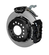 Wilwood black Dynalite service caliper and MC4 parking caliper around a 12.19-inch plain-face rotor, shown for modified GM 12-bolt axles with nonstaggered shocks