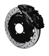 Wilwood black Dynapro 6 caliper over an assembled 12.88-inch drilled-and-slotted rotor and separate mounting hat