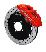 Wilwood red Dynapro 6 caliper over an assembled 12.88-inch drilled-and-slotted rotor and separate mounting hat