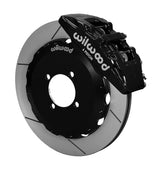 Wilwood black Dynapro 6 caliper over an assembled 12.88-inch slotted rotor and separate mounting hat