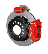 Wilwood red Dynalite service caliper and MC4 parking caliper around a 12.19-inch plain-face rotor, shown for modified GM 12-bolt axles with staggered shocks