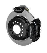 Wilwood black Dynalite service caliper and MC4 parking caliper around a 12.19-inch plain-face rotor, shown for modified GM 12-bolt axles with staggered shocks