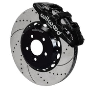 Wilwood black AERO6 front caliper with an assembled 15-inch drilled-and-slotted rotor and black mounting hat, shown for 2016–2024 Camaro
