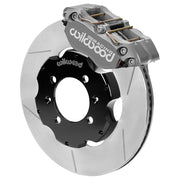 Wilwood Dynapro / ST brake kit: Single-side assembly with a gray Dynapro caliper above a slotted rotor and black hat; no separate wheel hub is shown; 11-inch front brake setup for Miata.