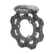 Wilwood Powerlite brake kit: Gray Powerlite caliper over a scalloped drilled rotor and center adapter; the four-piston label is visible; 11.75-inch front brake setup for Dirt Modified.