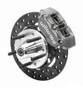 Wilwood Dynapro brake kit: An anodized Dynapro caliper beside a thin drilled rotor and aluminum hub with five protruding wheel studs; 10.75-inch front brake setup for 1982–1992 Camaro/Firebird.