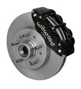 Wilwood Superlite 6R brake kit: Angled assembly of a black Superlite caliper and plain rotor with an integral hub and protruding wheel studs; 11.86-inch front brake setup for 1964–1970 Chevy/GMC 2WD.