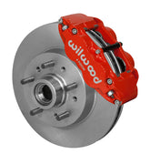 Wilwood Superlite 6R brake kit: A red Superlite caliper beside a plain rotor and integral studded hub in an assembled view; 11.86-inch front brake setup for 1960–1963 Chevy/GMC 2WD.