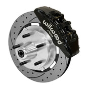 Wilwood Dynapro 6 brake kit: Single-side assembly with a black caliper, drilled-and-slotted rotor and polished aluminum hub with five wheel studs; 12.19-inch front brake setup for ProSpindle 5 x 5.