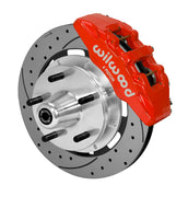Wilwood Dynapro 6 brake kit: Single-side assembly with a red caliper, drilled-and-slotted rotor and polished aluminum hub with five wheel studs; 12.19-inch front brake setup for ProSpindle 5 x 5.