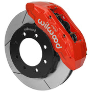 Wilwood TX6R brake kit: A red TX6R caliper above a slotted rotor and black eight-hole hat in an angled assembly; 15-inch front brake setup for F-250/F-350 4WD SRW.
