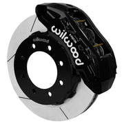 Wilwood TX6R brake kit: A black TX6R caliper above a slotted rotor and black eight-hole hat in an angled assembly; 15-inch front brake setup for F-250/F-350 4WD SRW.