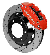 Wilwood Superlite 6R brake kit: A red Superlite caliper above a drilled-and-slotted rotor and deep black six-hole hat; 14-inch front brake setup for Toyota/Lexus Six-Lug.