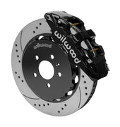 Wilwood AERO6 brake kit: Angled assembly of a black AERO6 caliper beside a drilled-and-slotted rotor and black five-hole hat; 14-inch front brake setup for Audi A4/A5/S4/S5.