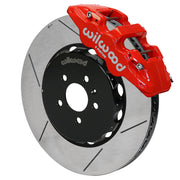Wilwood AERO6 brake kit: Angled assembly of a red AERO6 caliper beside a slotted rotor and black five-hole hat; 15-inch front brake setup for Audi A4/A5/S4/S5.