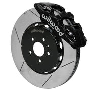 Wilwood AERO6 brake kit: Angled assembly of a black AERO6 caliper beside a slotted rotor and black five-hole hat; 15-inch front brake setup for Audi A4/A5/S4/S5.