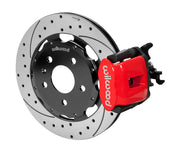 Wilwood CPB brake kit: A red combination caliper with its parking-brake mechanism beside a drilled-and-slotted rotor and black hat; 12.19-inch rear brake setup for Audi A4/S4/RS4/S5.