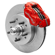 Wilwood Dynalite-M brake kit: A red Dynalite caliper and plain rotor assembled around an integral studded hub with a polished dust cap; 11.5-inch front brake setup for Classic Chevy/Corvette.