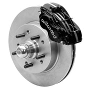 Wilwood Dynalite-M brake kit: A black Dynalite caliper and plain rotor assembled around an integral studded hub with a polished dust cap; 11.5-inch front brake setup for Classic Chevy/Corvette.