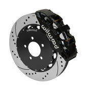Wilwood AERO6 brake kit: A black caliper alongside a drilled-and-slotted rotor attached to a dark five-hole hat in an angled view; 14-inch front brake setup for Ford Panther Cars.