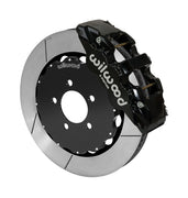 Wilwood AERO6 brake kit: A black caliper alongside a slotted rotor attached to a dark five-hole hat in an angled view; 14-inch front brake setup for Ford Panther Cars.