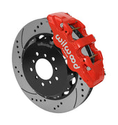 Wilwood AERO6 brake kit: A red caliper beside a drilled-and-slotted rotor mounted to a black five-hole hat, viewed at an angle; 14-inch front brake setup for BMW E46 M3.