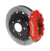 Wilwood Superlite 4R brake kit: A red caliper beside a slotted rotor mounted to a black five-hole hat, viewed at an angle; 12.88-inch rear brake setup for BMW E46 M3.