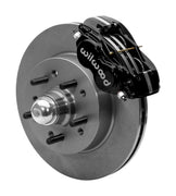 Wilwood Dynalite-M brake kit: Assembled black Dynalite caliper beside a plain rotor and integral studded hub with a polished dust cap; 11.5-inch front brake setup for 1965–1968 Chevy Full-Size.