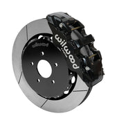 Wilwood AERO6 brake kit: Single black AERO6 caliper beside a slotted rotor assembled to a dark five-hole hat; 14-inch front brake setup for 370Z/G35/G37.