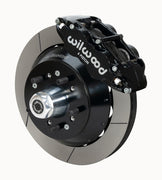 Wilwood Superlite 6R brake kit: A black caliper beside a slotted rotor and deep black hat over a wheel hub, with visible studs and a polished dust cap; 12.88-inch front brake setup for 1957–1967 F-100.