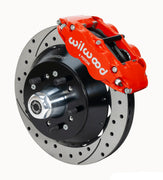Wilwood Superlite 6R brake kit: A red caliper beside a drilled-and-slotted rotor and deep black hat over a wheel hub, with visible studs and a polished dust cap; 12.88-inch front brake setup for 1968–1972 F-100 2WD.