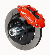 Wilwood Superlite 6R brake kit: A red caliper beside a slotted rotor and deep black hat over a wheel hub, with visible studs and a polished dust cap; 12.88-inch front brake setup for 1968–1972 F-100 2WD.