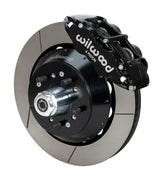 Wilwood F-100 4x2 drum-spindle front assembly with a black Superlite 6R caliper, 14.00-inch GT-slotted rotor and central wheel hub with studs