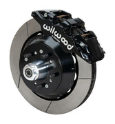 Wilwood F-100 AERO6 drum-spindle front assembly with a black AERO6 caliper, 14.00-inch GT-slotted rotor and central wheel hub with studs