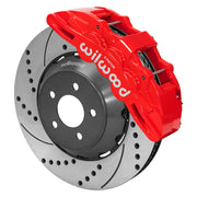 Wilwood Mustang or Ridetech hub-spindle 15-inch front assembly with a red SX6R caliper beside a 15.00-inch drilled-and-slotted rotor and its mounting hat