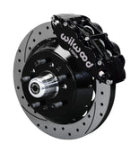 Wilwood 5x5 ProSpindle 12.88-inch front assembly with a black Superlite 6R caliper, 12.88-inch drilled-and-slotted rotor and central wheel hub with studs