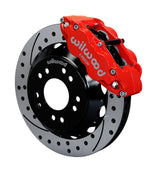 Wilwood C10 modular Pro Drop 13.06-inch front assembly with a red Superlite 6R caliper beside a 13.06-inch drilled-and-slotted rotor and its mounting hat