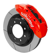Wilwood red TX6R caliper over an assembled 16-inch slotted rotor and separate hat for the Ram HD front installation
