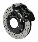 Wilwood black Dynapro dust-sealed caliper over an assembled 11-inch drilled-and-slotted rotor and separate hat for the Series I Jaguar front installation