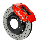 Wilwood red Dynapro dust-sealed caliper over an assembled 11-inch drilled-and-slotted rotor and separate hat for the Series I Jaguar front installation