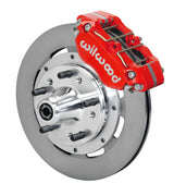 Wilwood red four-piston front caliper beside a 12.19-inch plain-face rotor with projecting wheel hub for the 1970–1974 Ford/Mercury spindle installation