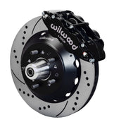Wilwood black six-piston front caliper beside a 14-inch drilled-and-slotted rotor, separate hat and projecting hub for the early Ford V8 spindle installation