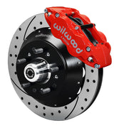 Wilwood red six-piston front caliper beside a 14-inch drilled-and-slotted rotor, separate hat and projecting hub for the GM/Ridetech pin-spindle front installation