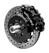 Wilwood black six-piston front caliper beside a 12.88-inch drilled-and-slotted rotor, separate hat and projecting hub for the CPP Tri-Five 12.88-inch front installation