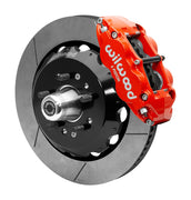 Wilwood red six-piston front caliper beside a 14-inch slotted rotor, separate hat and projecting hub for the CPP Tri-Five 14-inch Superlite front installation
