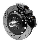 Wilwood black six-piston front caliper beside a 14-inch drilled-and-slotted rotor, separate hat and projecting hub for the CPP Tri-Five 14-inch AERO6 front installation